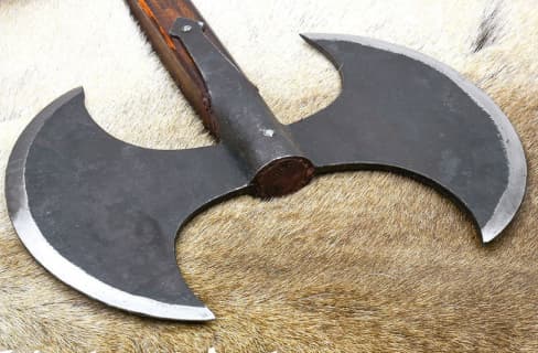 image of double bladed axe laying on hide